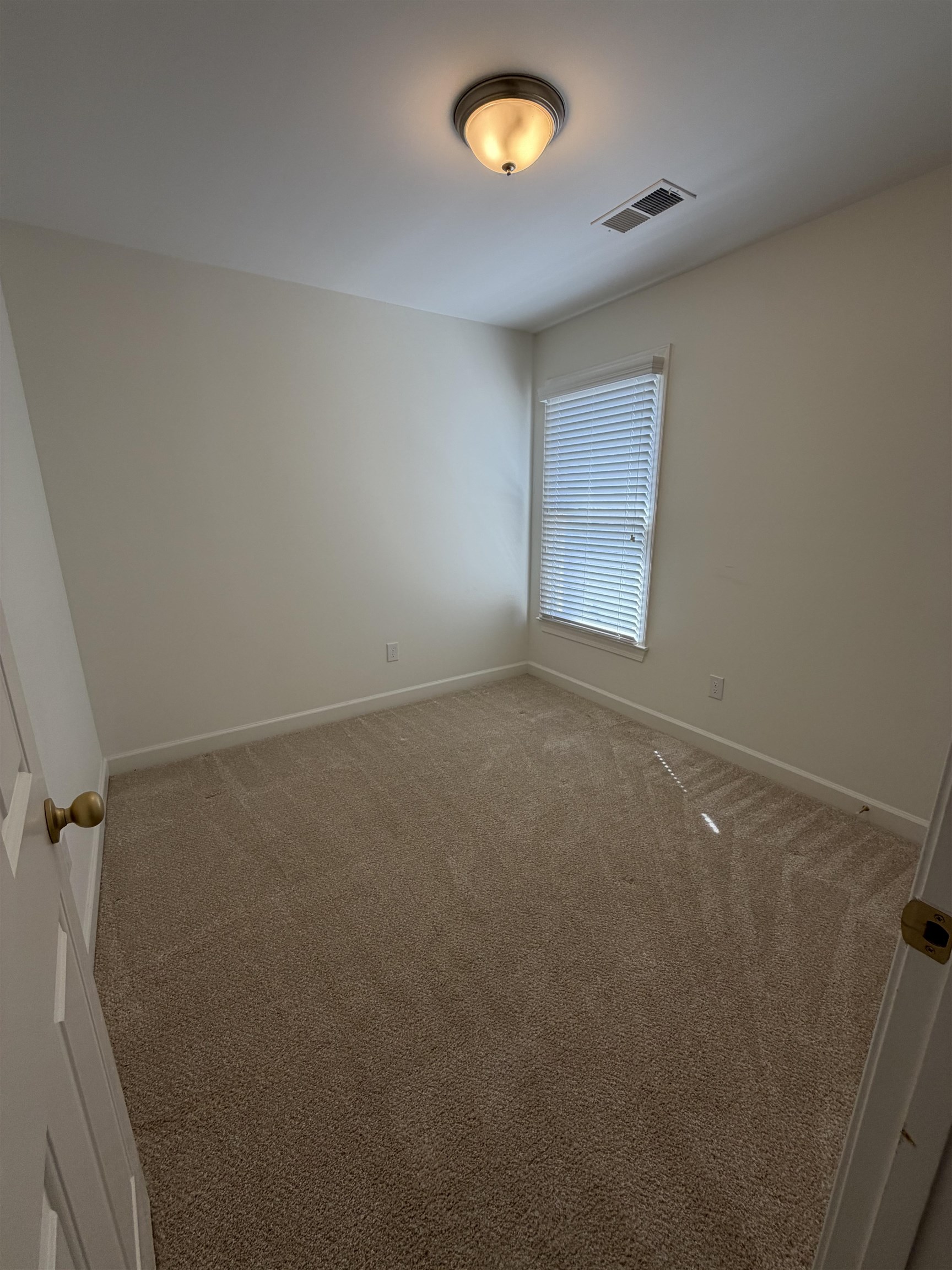 147 Greeff Lane Memphis, TN 38111 - Photo 22 of 23 an empty room with a window
