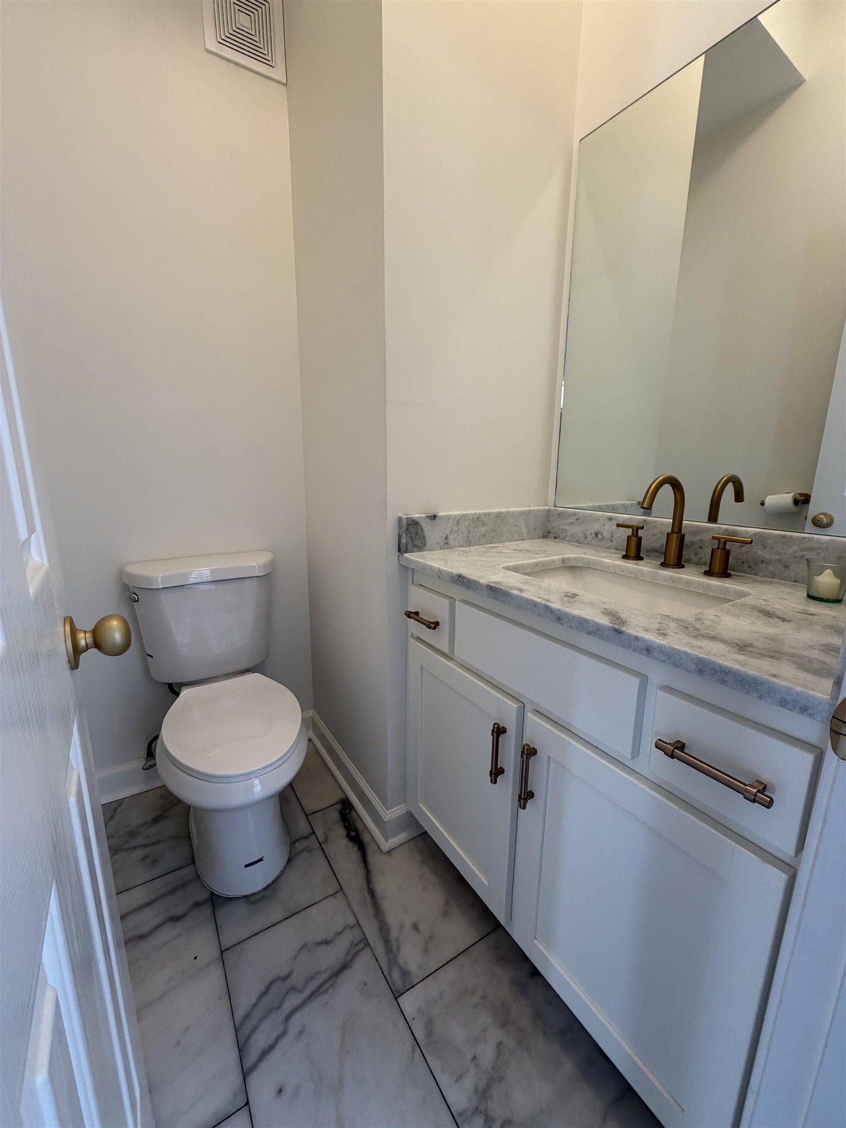 147 Greeff Lane Memphis, TN 38111 - Photo 10 of 23 a bathroom with a granite countertop toilet and a sink