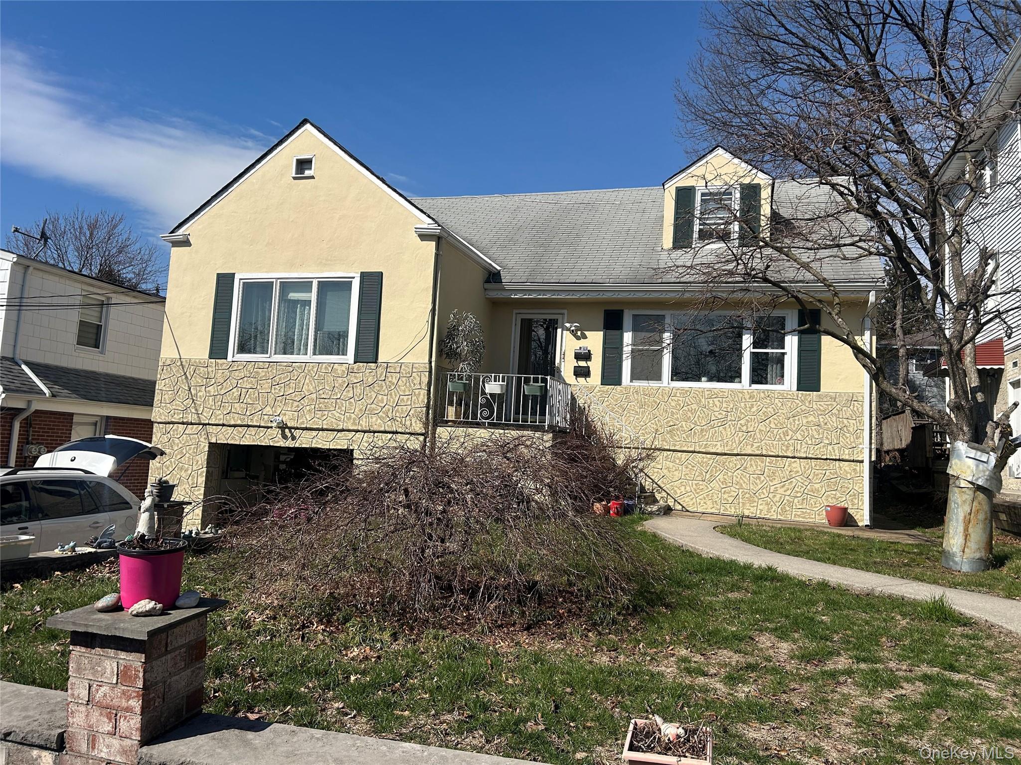 a front view of a house with a yard