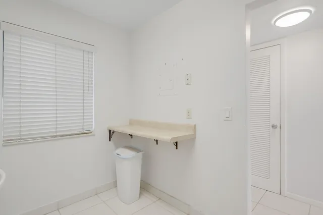 a view of a storage & utility room with a window