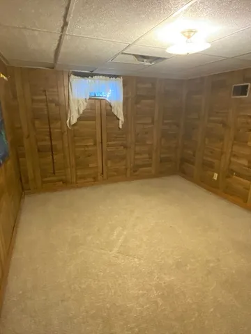 a view of a park with large trees