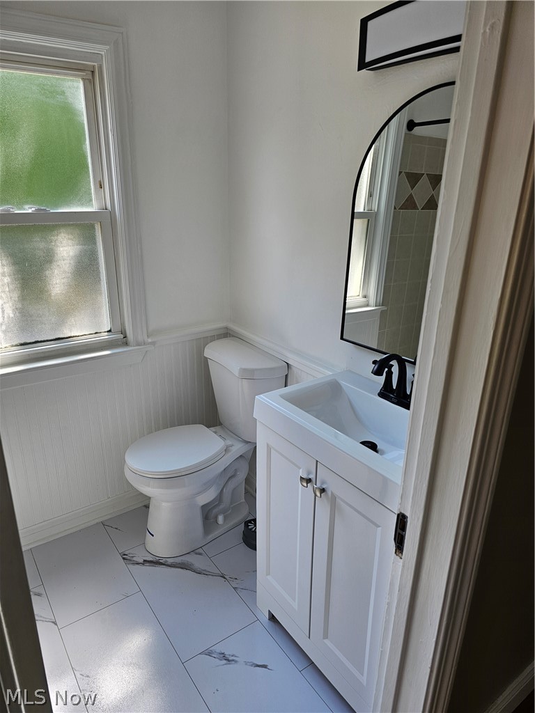 1147 Mayfield Ridge Road Cleveland, OH 44124 - Photo 16 of 23 Bathroom featuring tile patterned floors, vanity, and toilet