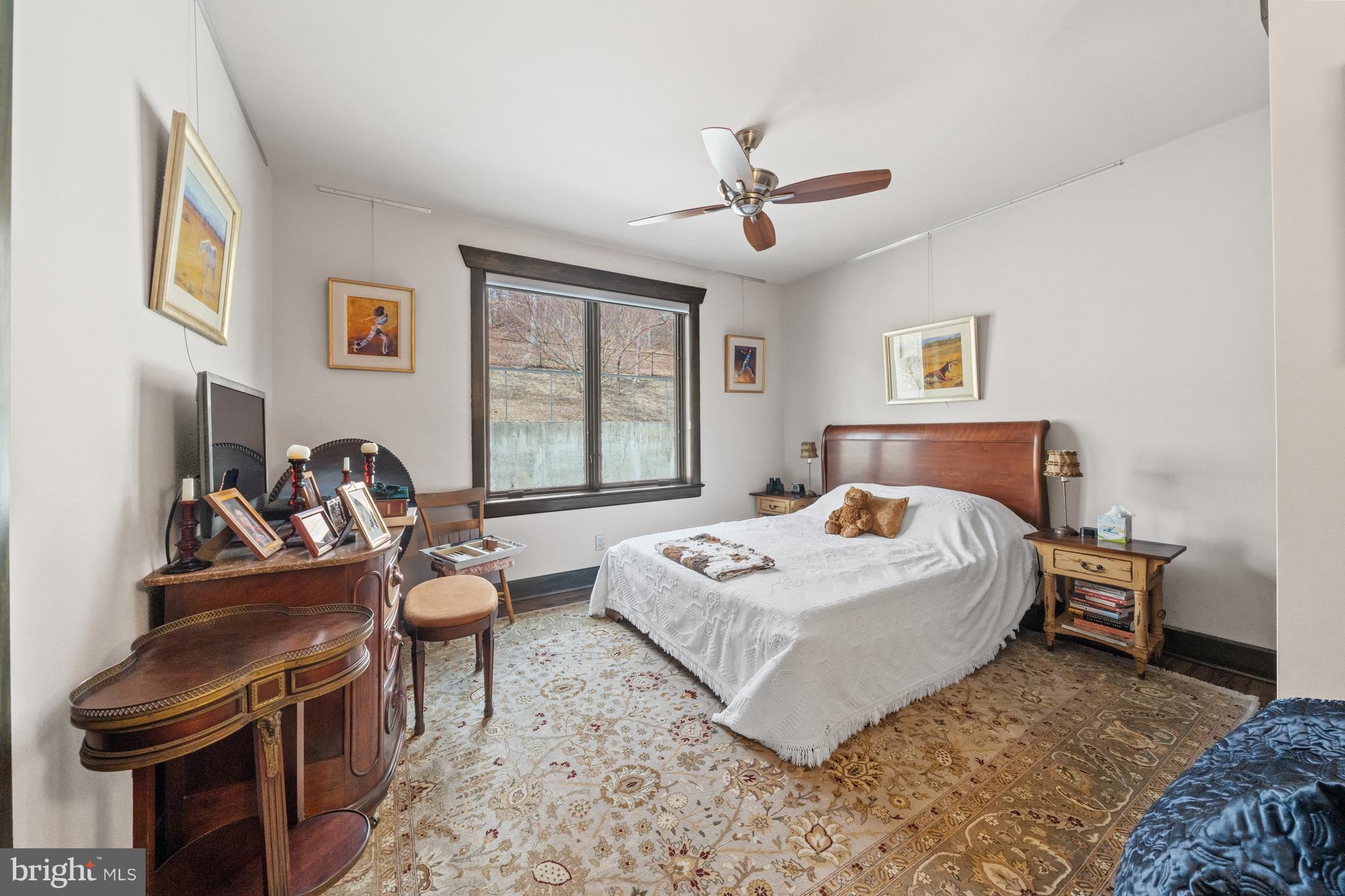 3924 Thompsons Bridge Road Wilmington, DE 19807 - Photo 17 of 78 a bedroom with a bed and a chandelier