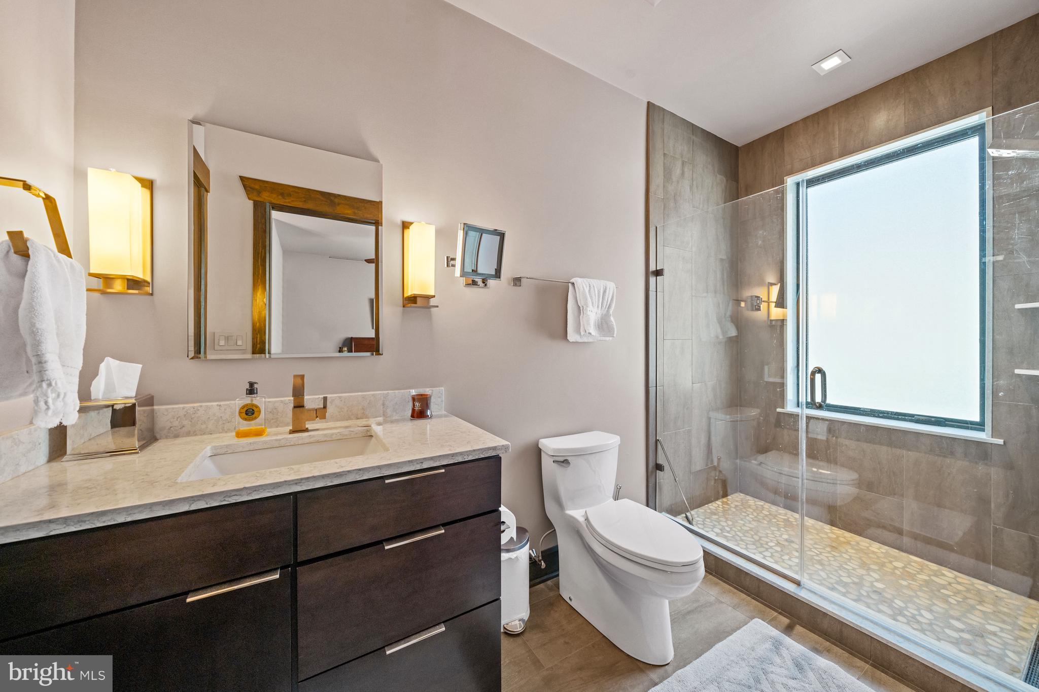 3924 Thompsons Bridge Road Wilmington, DE 19807 - Photo 18 of 78 a bathroom with a double vanity sink toilet mirror and bathtub