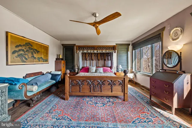 a dining room with furniture window and wooden floor