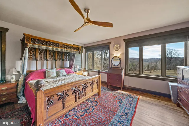 a living room with fireplace furniture and a flat screen tv