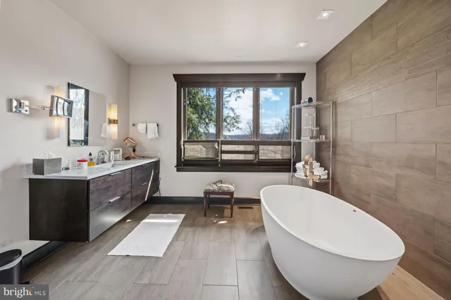 a bedroom with a bed next to a window with the outer view