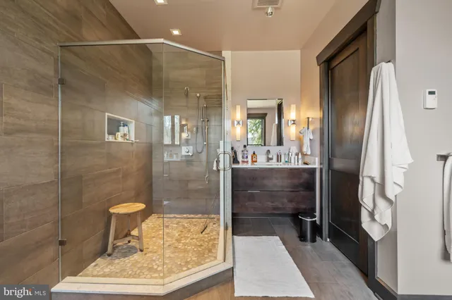 a bathroom with a sink a toilet and a window