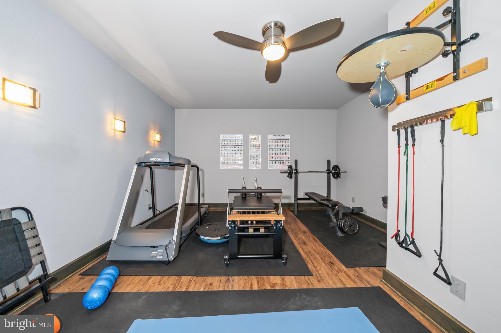 3924 Thompsons Bridge Road Wilmington, DE 19807 - Photo 30 of 78 a room with gym equipment and a wooden floor