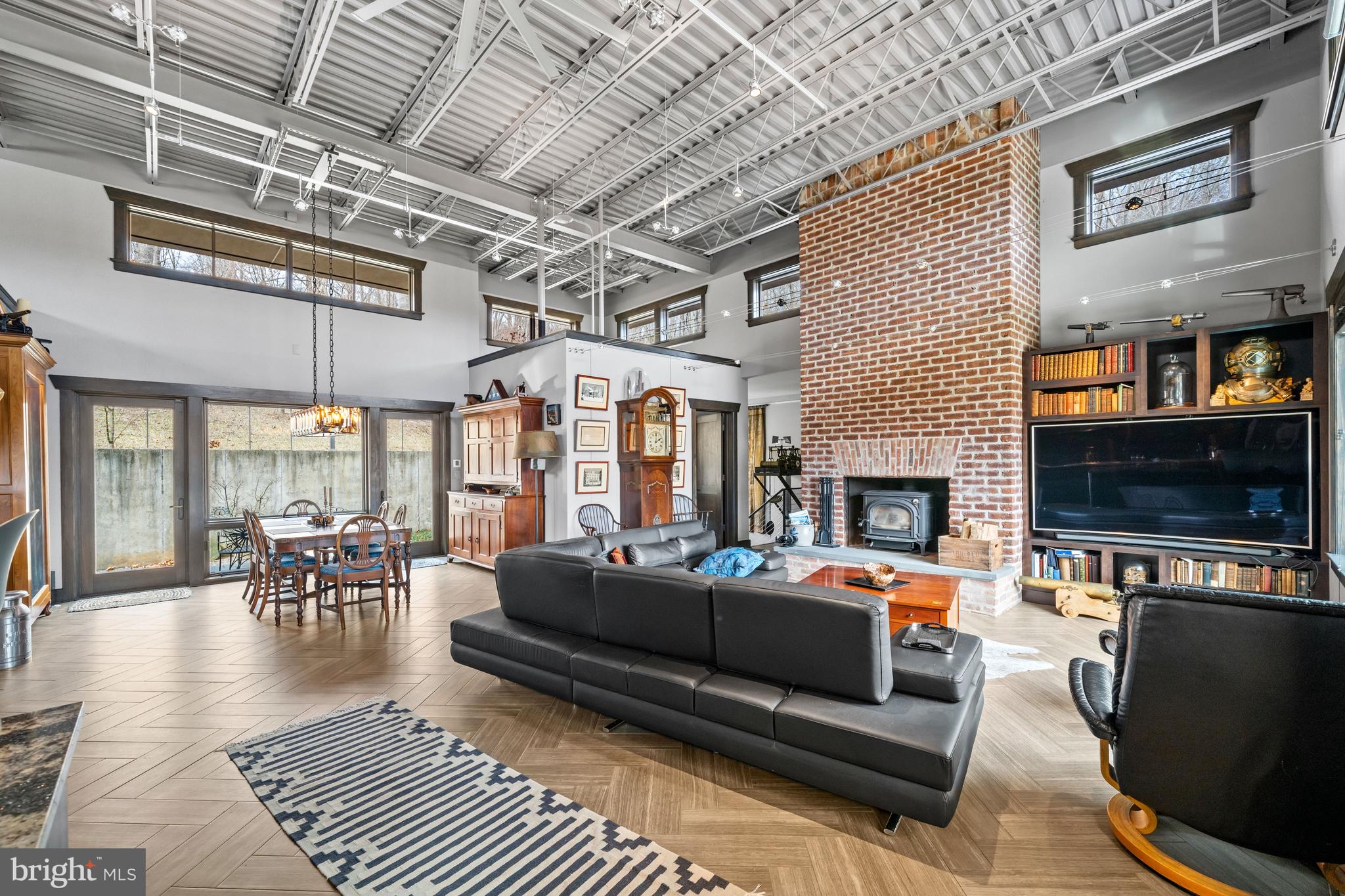 3924 Thompsons Bridge Road Wilmington, DE 19807 - Photo 3 of 78 a living room with furniture a fireplace and a flat screen tv