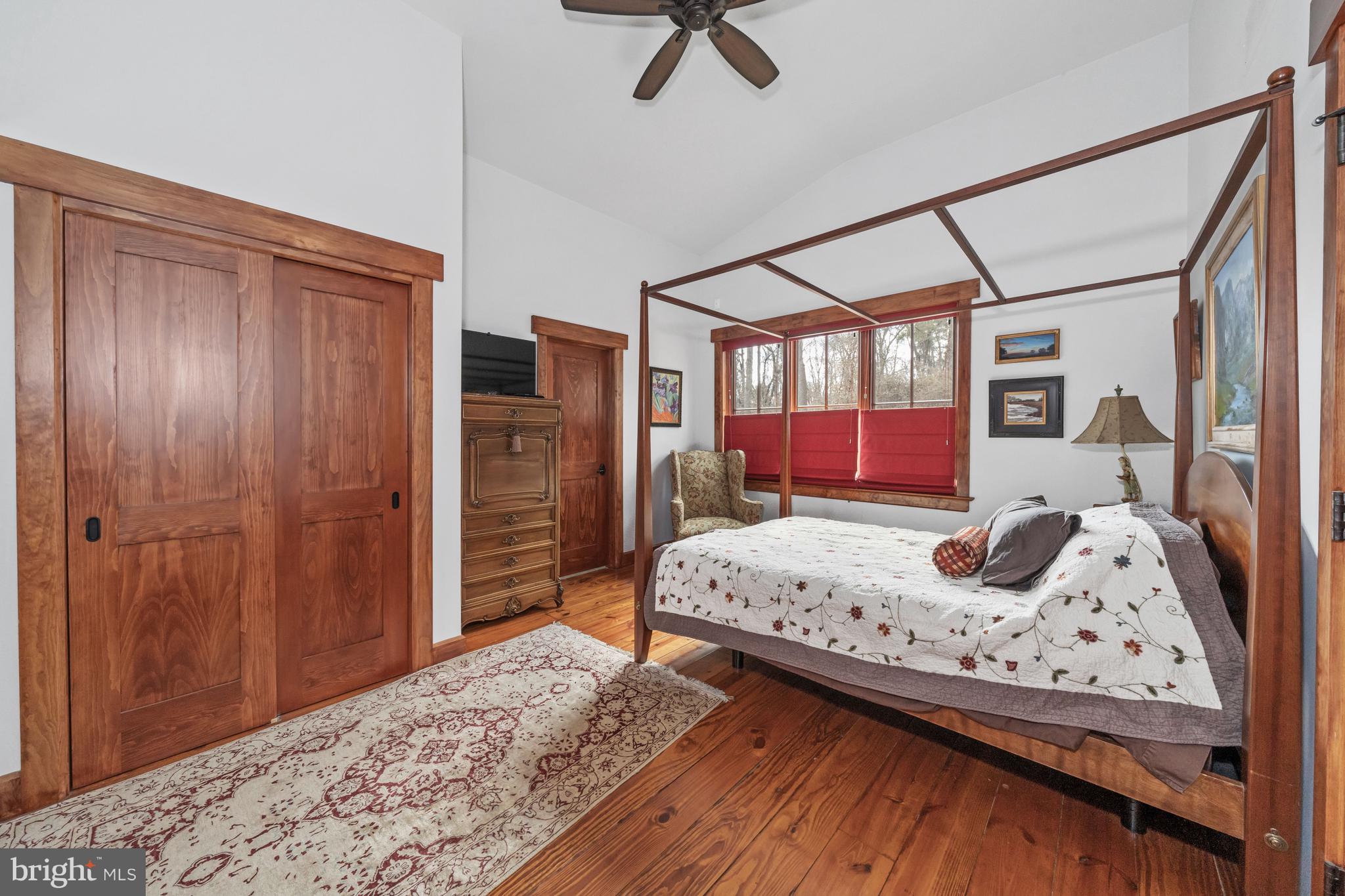 3924 Thompsons Bridge Road Wilmington, DE 19807 - Photo 44 of 78 a bedroom with a bed a dresser and flowerpot
