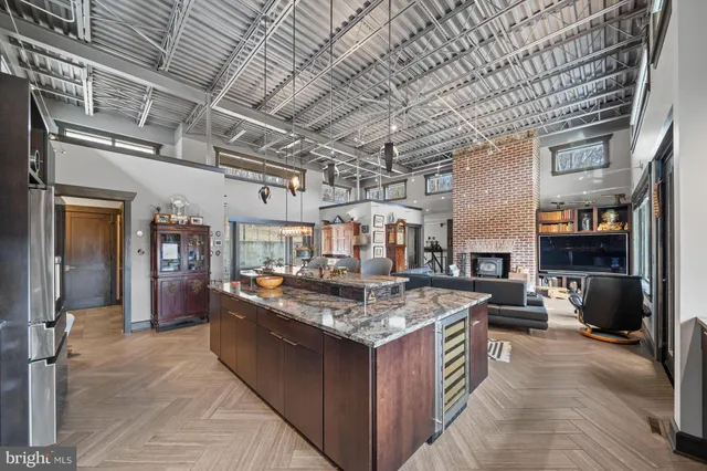 a bathroom with a double vanity sink toilet mirror and bathtub