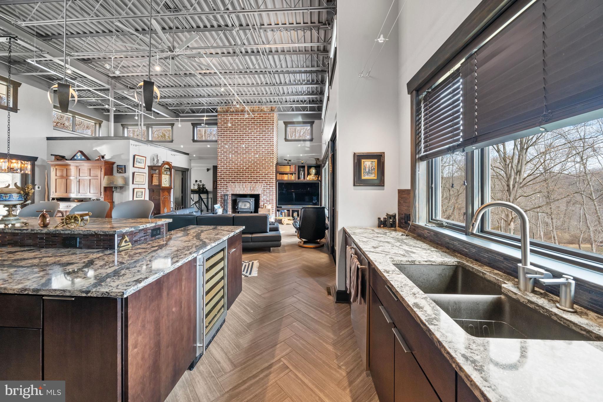 3924 Thompsons Bridge Road Wilmington, DE 19807 - Photo 10 of 78 a kitchen with stainless steel appliances granite countertop a sink a stove and a wooden cabinets