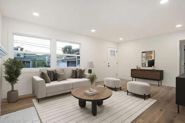 a living room with furniture and a large window