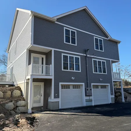 a front view of a house with a garage
