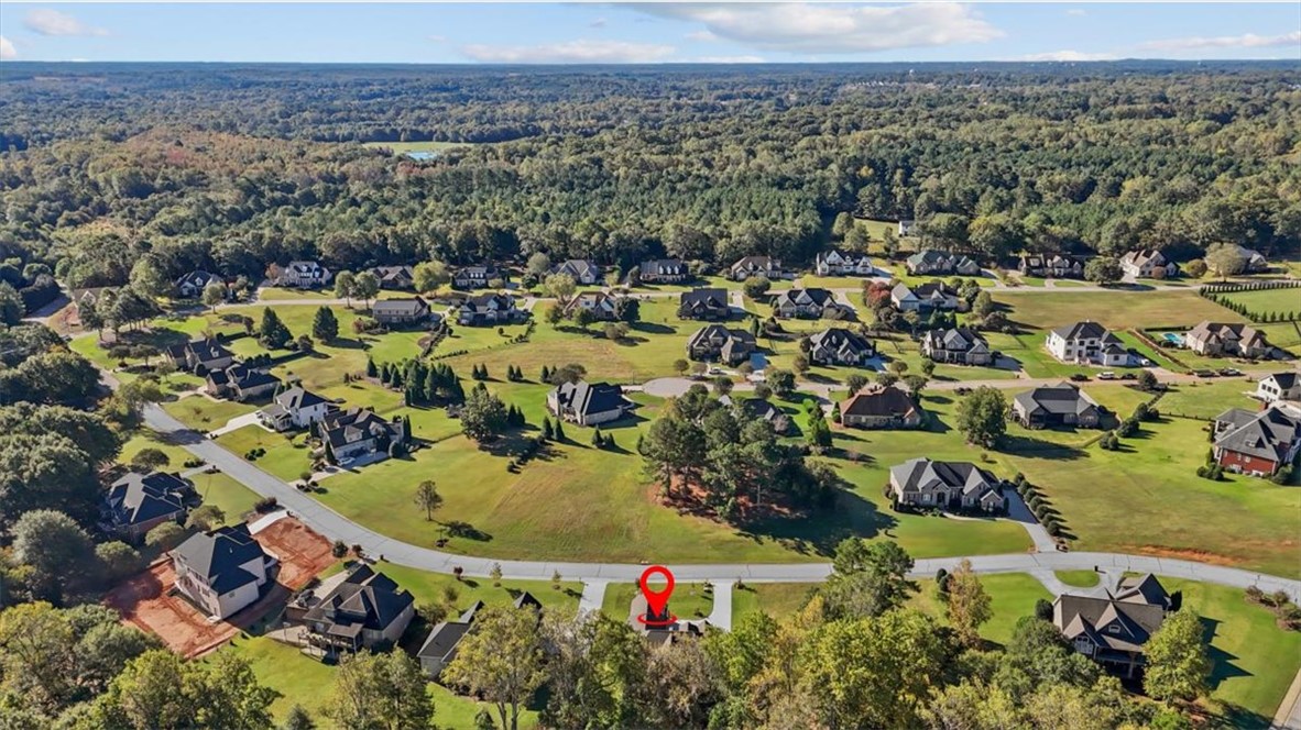 105 Bree Drive Anderson, SC 29621 - Photo 45 of 48 An aerial perspective reveals a residential community with verdant landscaping nestled amongst a dense woodland.