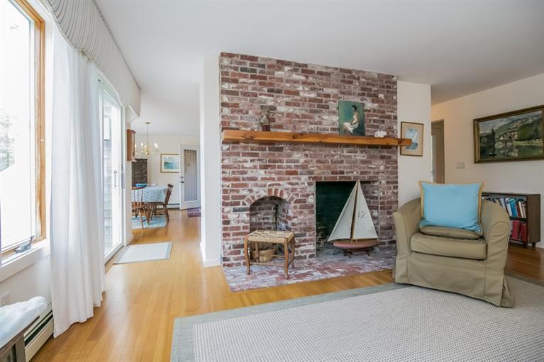 18 Cedar Land Road Orleans, MA 02653 - Photo 11 of 27 a living room with furniture and a fireplace