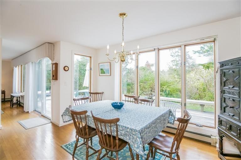 18 Cedar Land Road Orleans, MA 02653 - Photo 12 of 27 a view of a dining room with furniture window and wooden floor