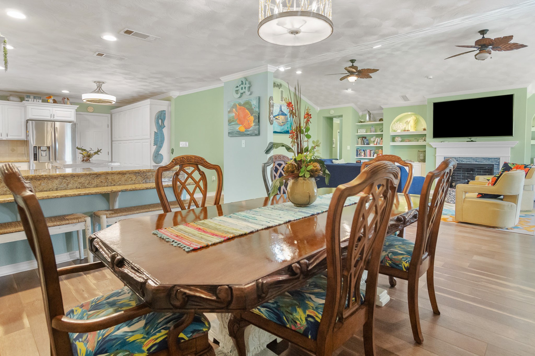 3297 Prides Way Crystal Beach, TX 77650 - Photo 11 of 42 a view of a dining room with furniture and wooden floor