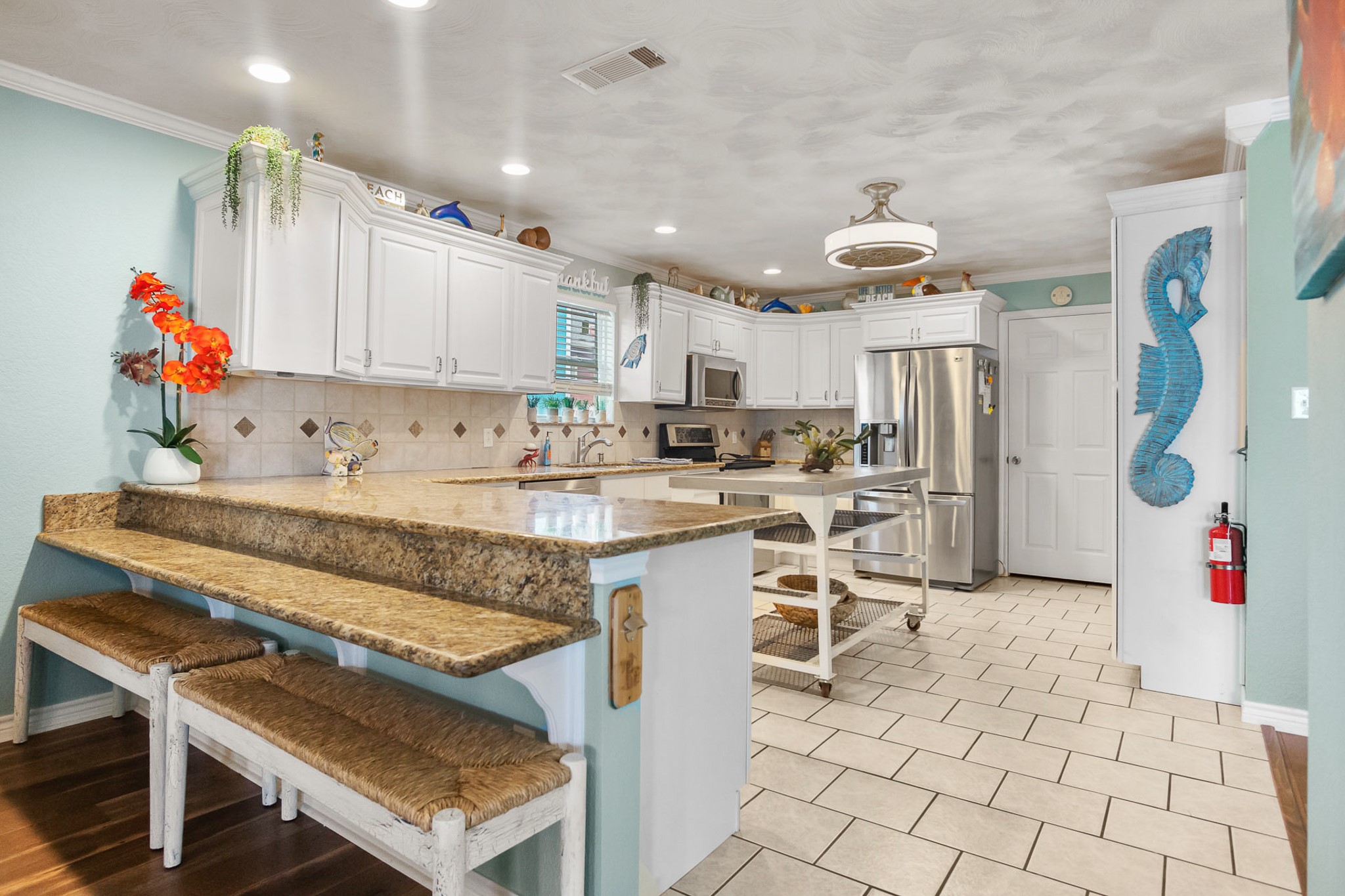 3297 Prides Way Crystal Beach, TX 77650 - Photo 13 of 42 a view of kitchen with cabinets microwave and refrigerator