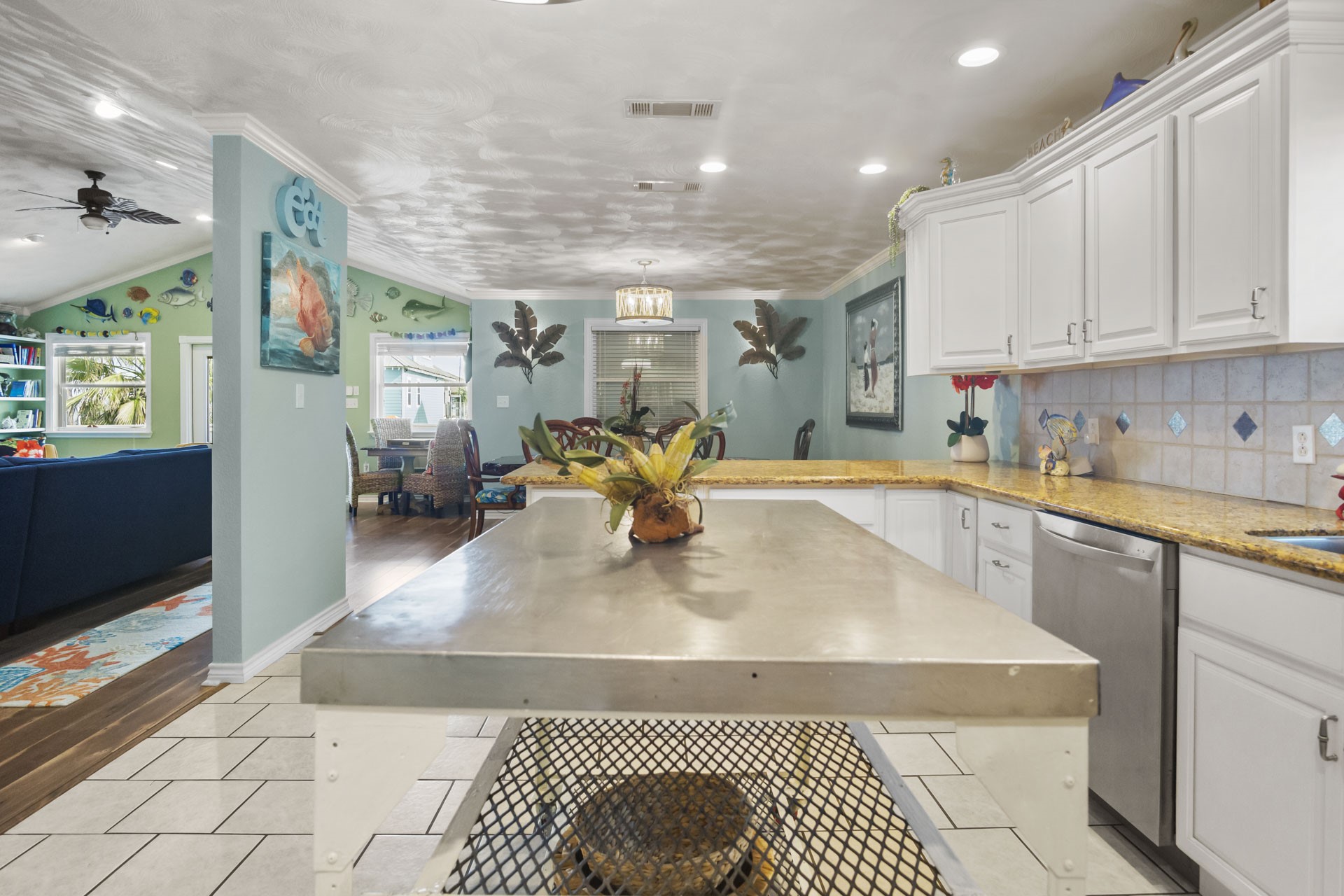 3297 Prides Way Crystal Beach, TX 77650 - Photo 15 of 42 a kitchen with stainless steel appliances granite countertop a sink a stove top oven a chimney and a center island