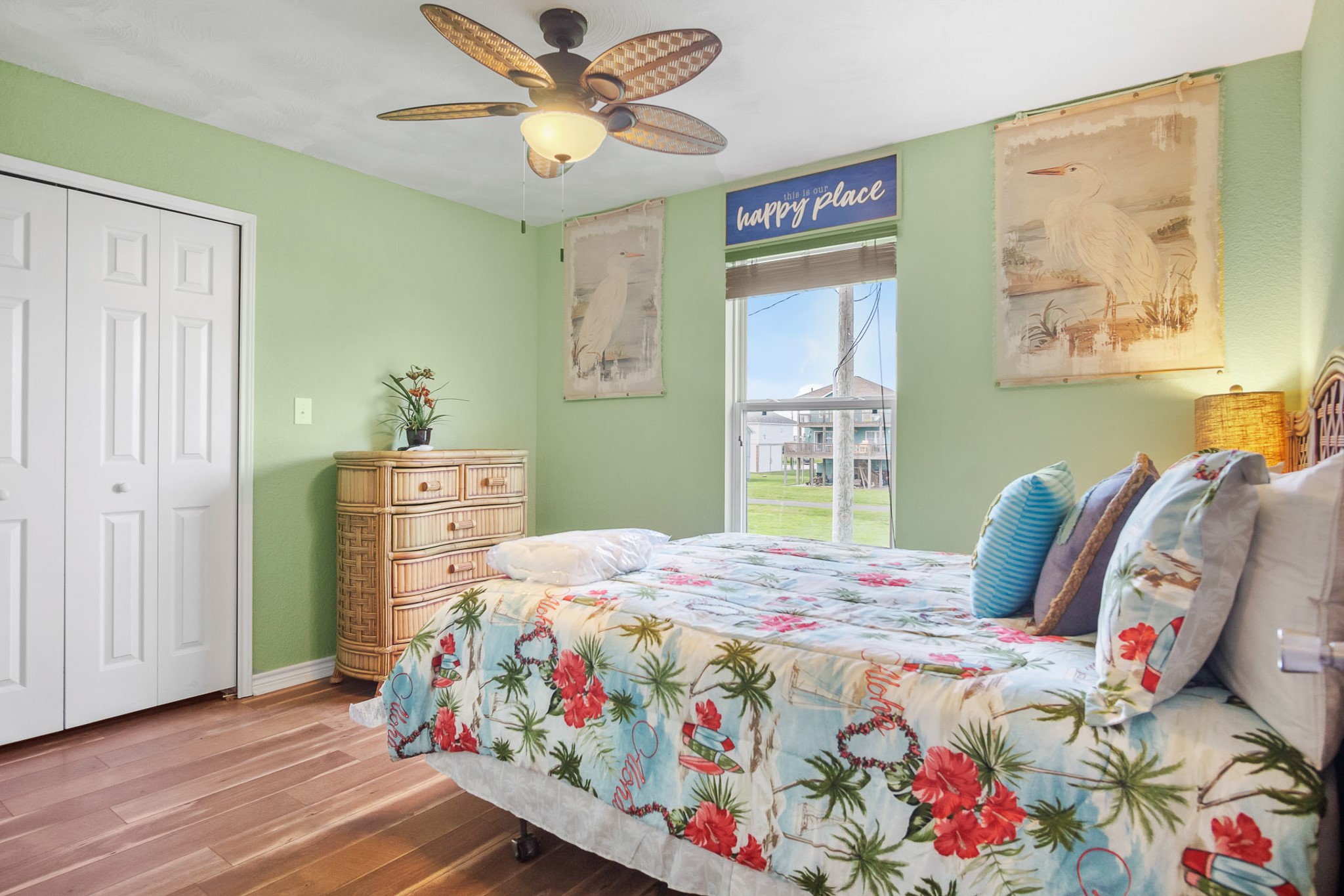 3297 Prides Way Crystal Beach, TX 77650 - Photo 19 of 42 a bedroom with a bed and wooden floor