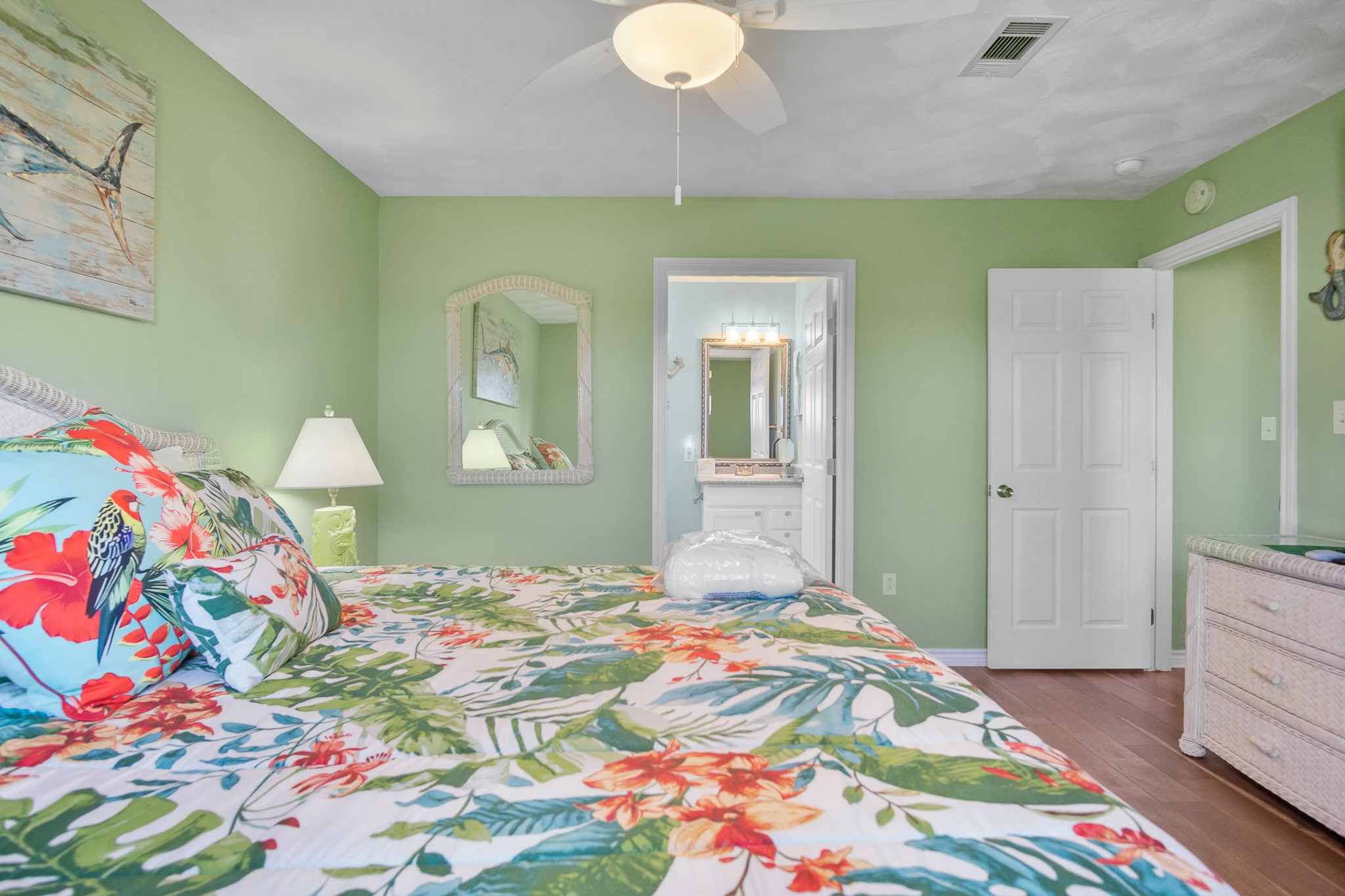 3297 Prides Way Crystal Beach, TX 77650 - Photo 23 of 42 a bedroom with a bed and a dresser