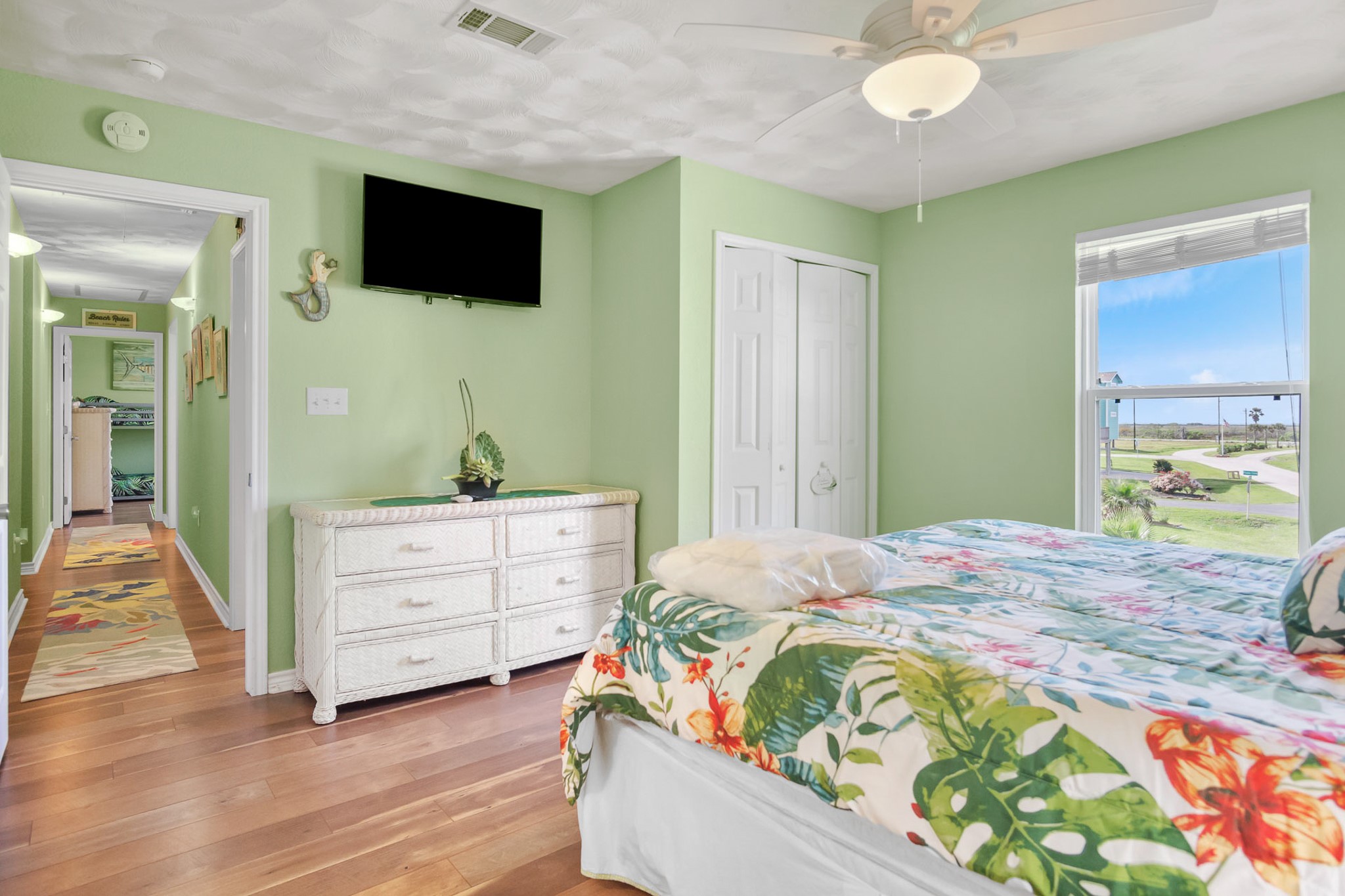 3297 Prides Way Crystal Beach, TX 77650 - Photo 24 of 42 a bedroom with a bed and a flat screen tv