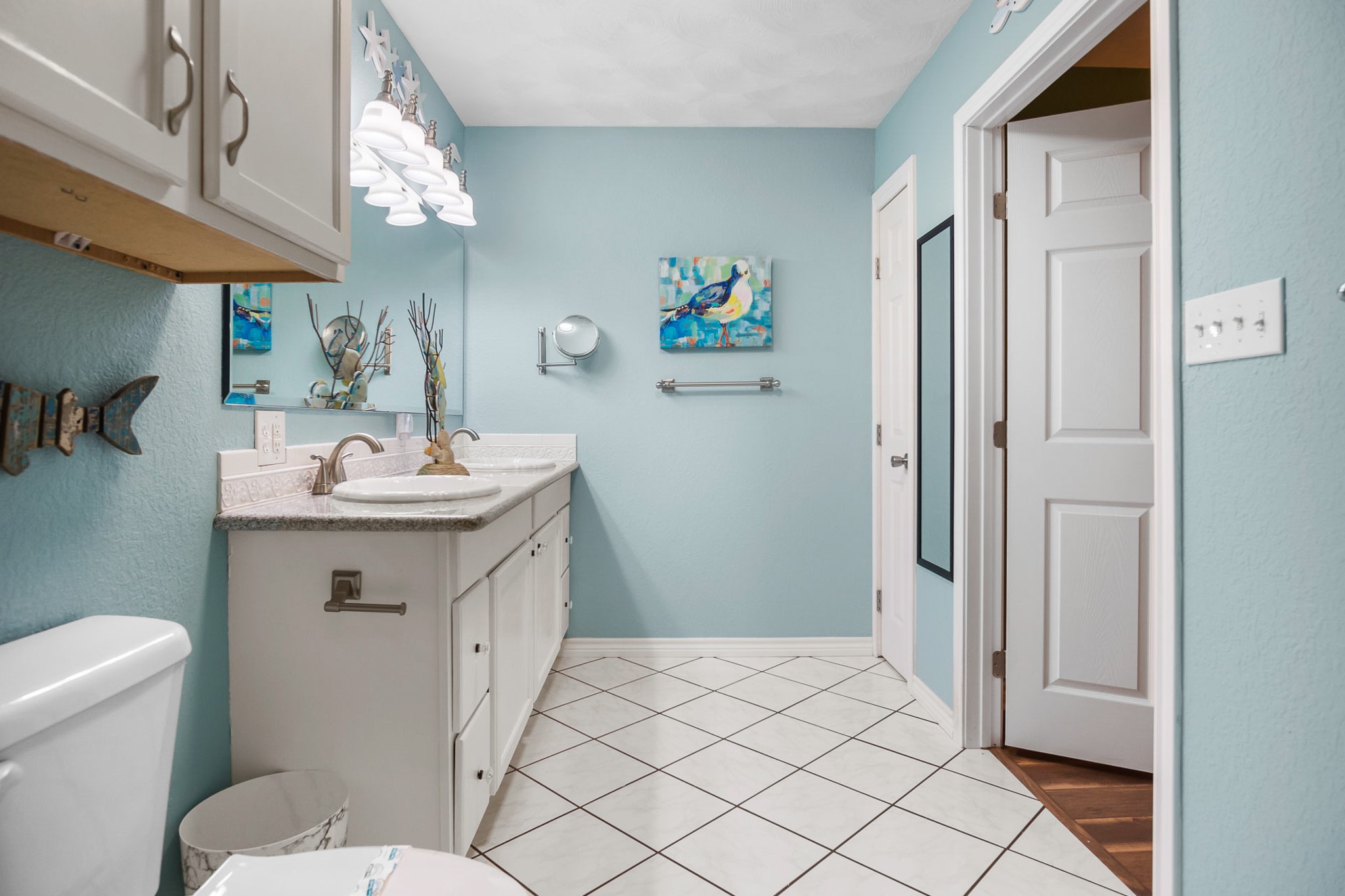 3297 Prides Way Crystal Beach, TX 77650 - Photo 32 of 42 a bathroom with a sink a toilet and a mirror