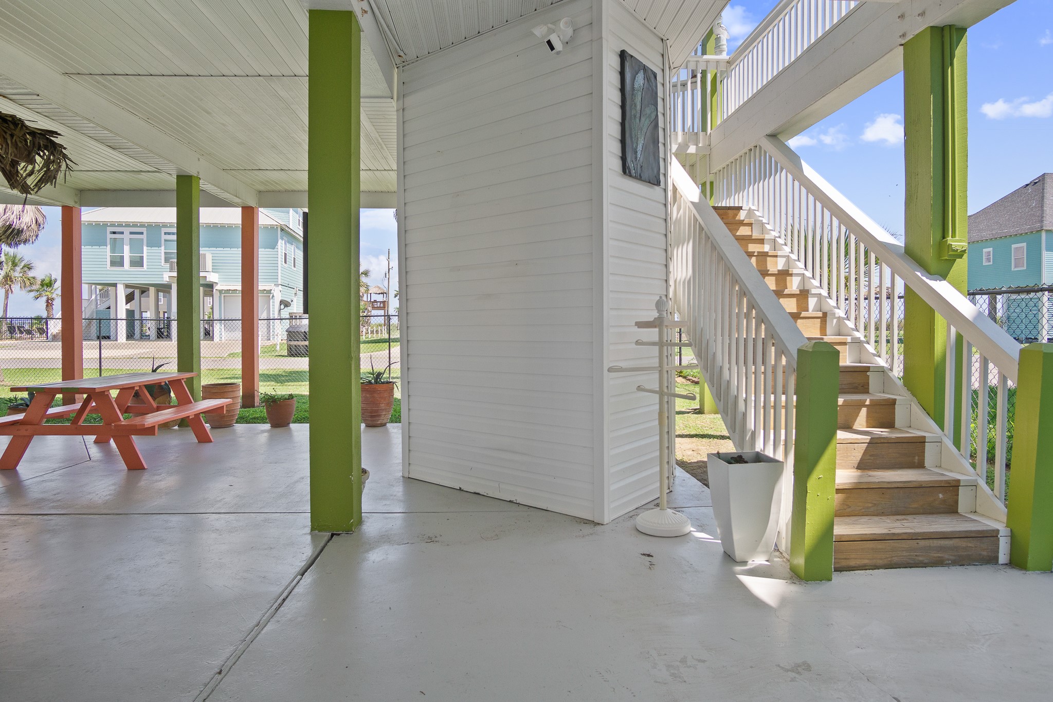 3297 Prides Way Crystal Beach, TX 77650 - Photo 5 of 42 a view of staircase with furniture and floor to ceiling windows