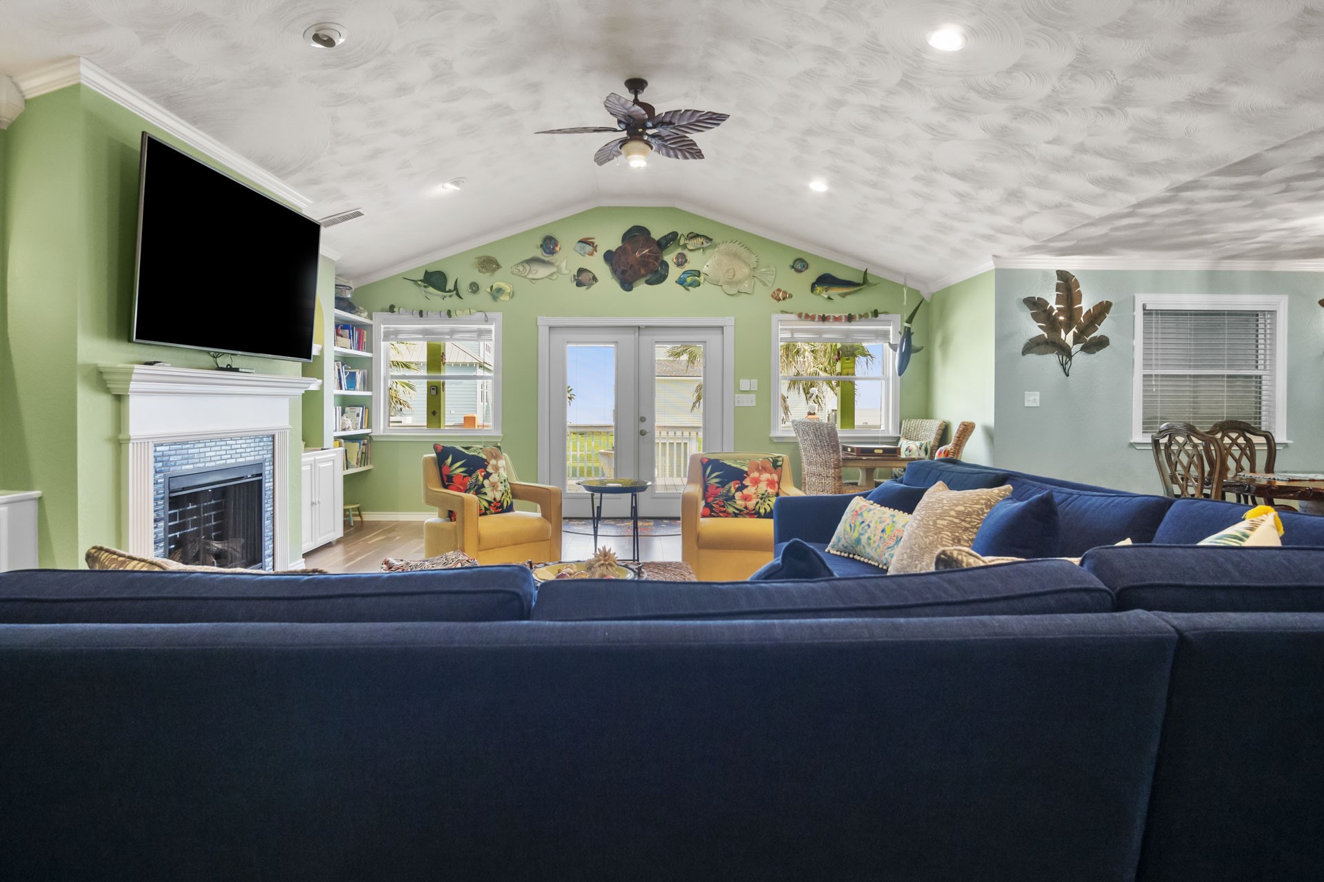3297 Prides Way Crystal Beach, TX 77650 - Photo 8 of 42 a living room with fireplace furniture and a flat screen tv