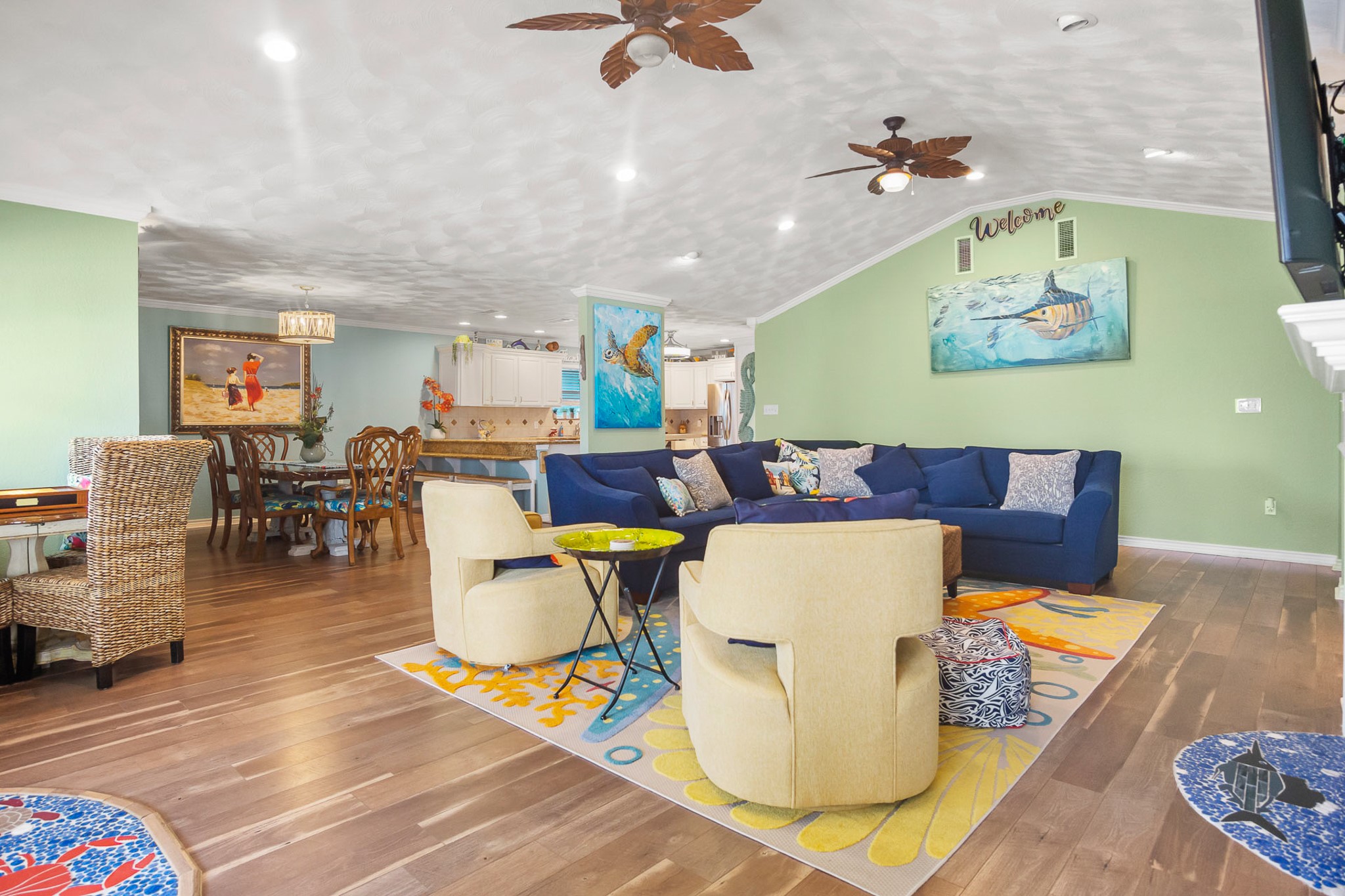 3297 Prides Way Crystal Beach, TX 77650 - Photo 9 of 42 a living room with dining room and wooden floor