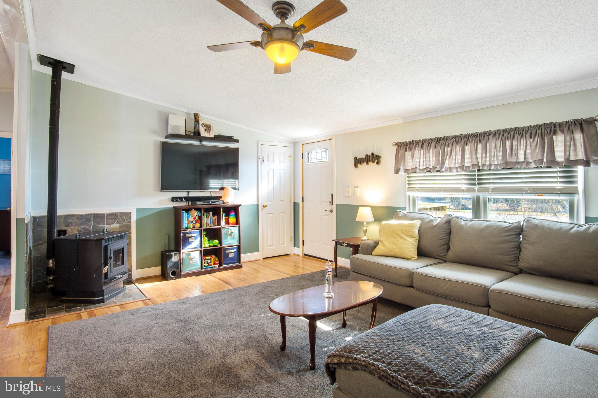 105 Locust Point Road Elkton, MD 21921 - Photo 5 of 20 Living room with pellet stove
