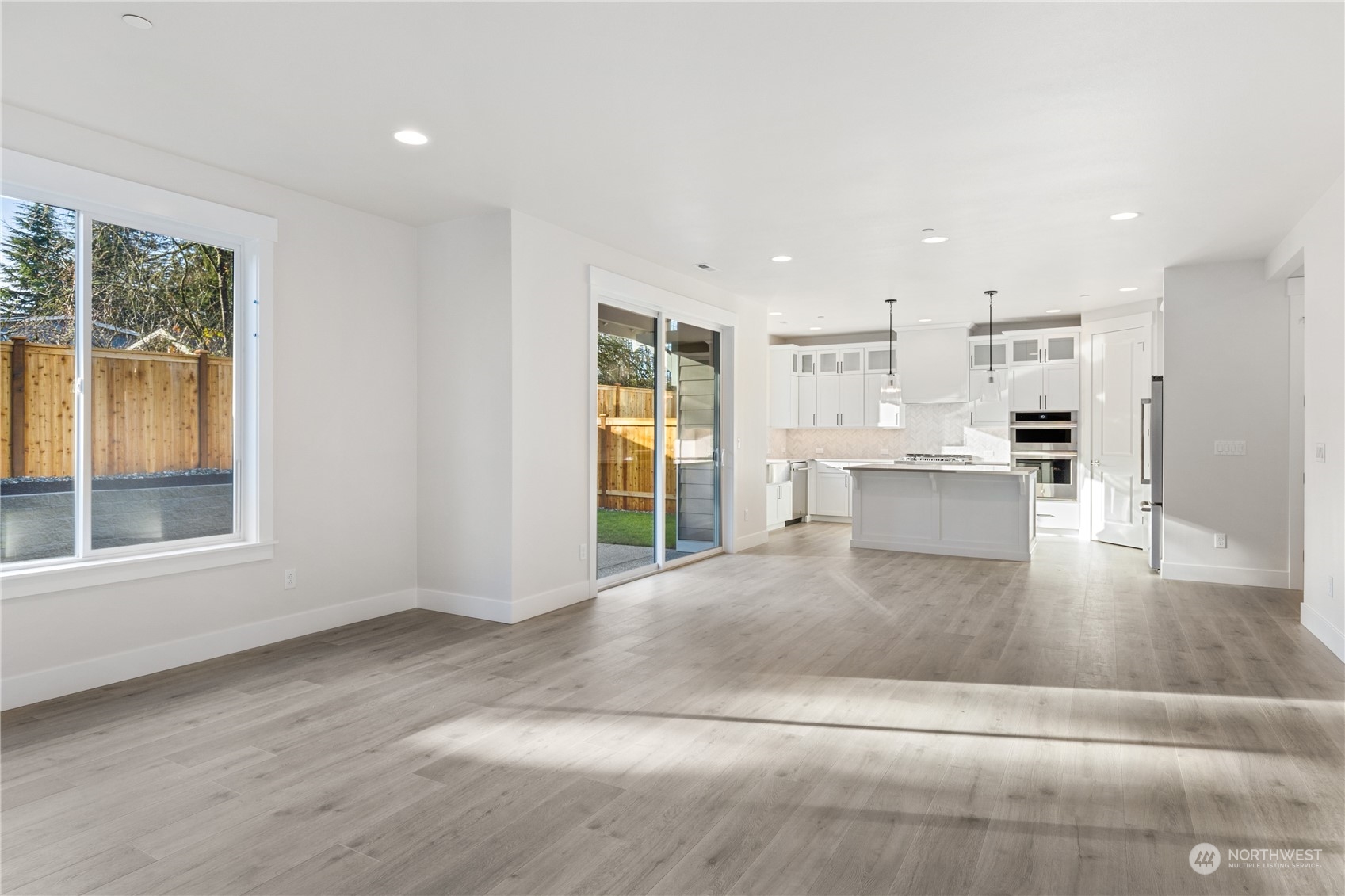 2421 242nd Place Southeast, Unit 9 Bothell, WA 98021 - Photo 11 of 15 a view of kitchen with wooden floor and windows