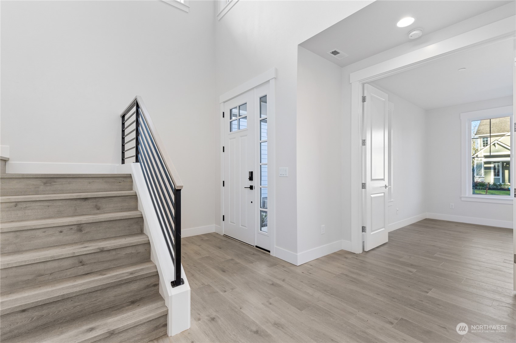 2421 242nd Place Southeast, Unit 9 Bothell, WA 98021 - Photo 4 of 15 a view of entryway with wooden floor