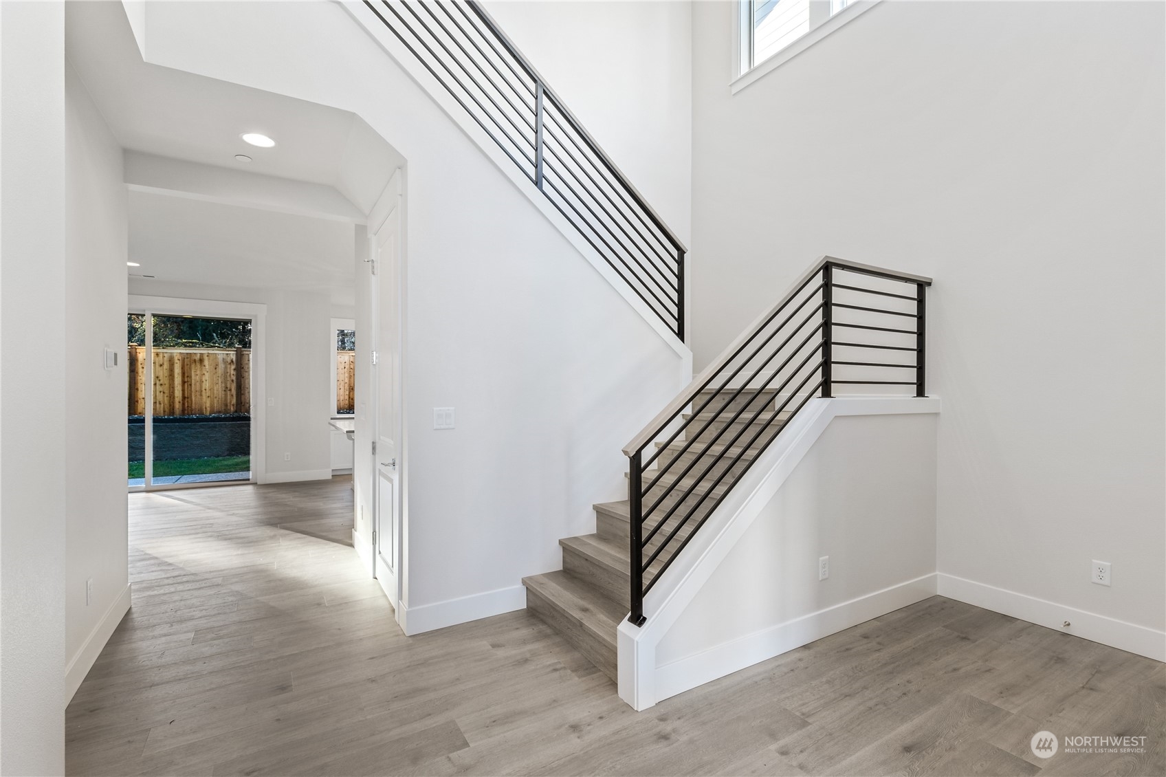 2421 242nd Place Southeast, Unit 9 Bothell, WA 98021 - Photo 8 of 15 an entryway in a hall with white walls