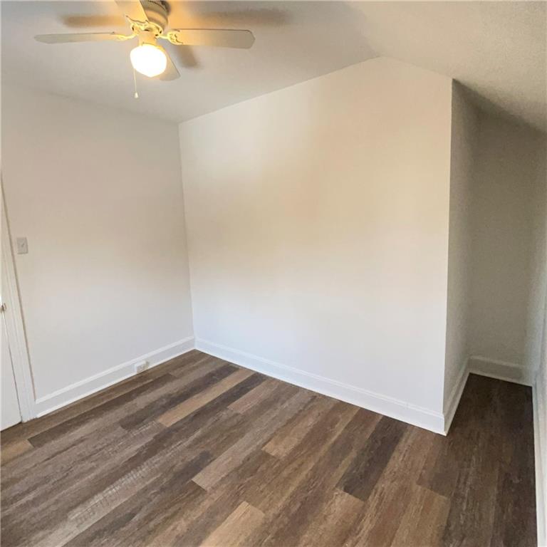 1360 Center Street McKees Rocks, PA 15136 - Photo 9 of 18 an empty room with wooden floor and fan