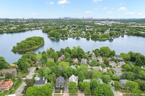 an aerial view of lake residential houses with outdoor space and lake view