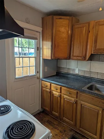 a kitchen with a sink and cabinets