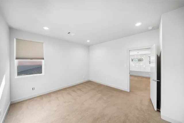 a bathroom with a toilet sink and a mirror