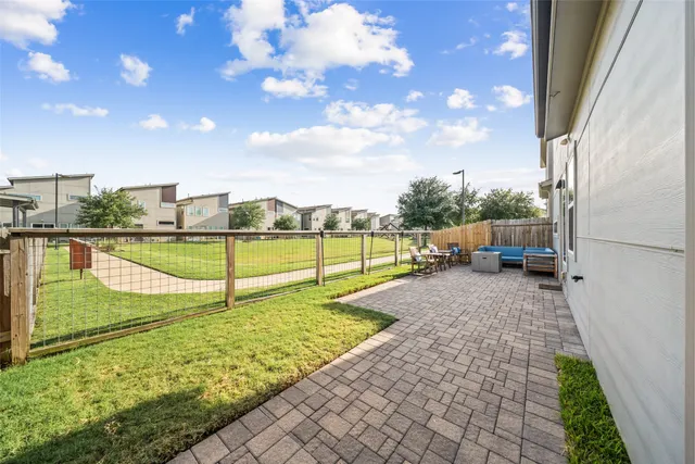 a view of a backyard with sitting area