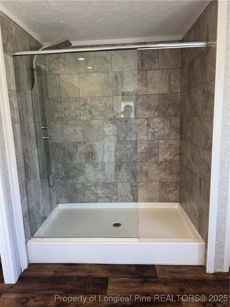 909 Wiregrass Road Hamlet, NC 28345 - Photo 14 of 27 a bathroom with a bathtub and a shower