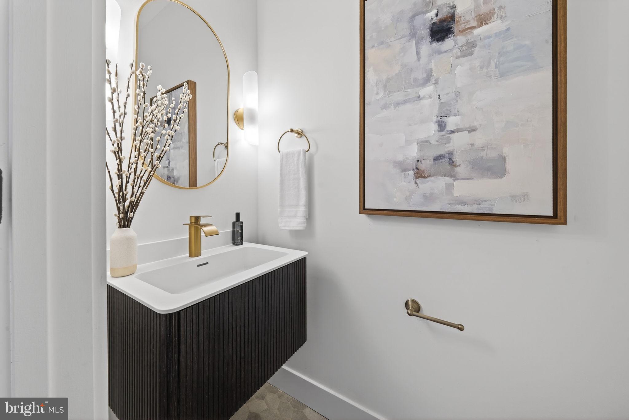 609 Harvard Street Northwest Washington, DC 20001 - Photo 15 of 41 a bathroom with a sink and a mirror
