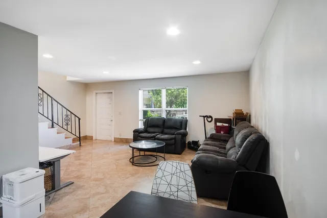 a living room with furniture or couch and a window