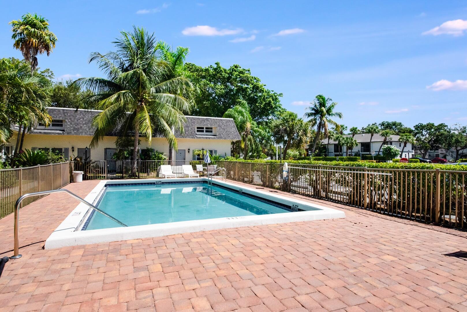 1945 Northwest 4th Avenue, Unit 30 Boca Raton, FL 33432 - Photo 29 of 30 a view of a swimming pool with a patio