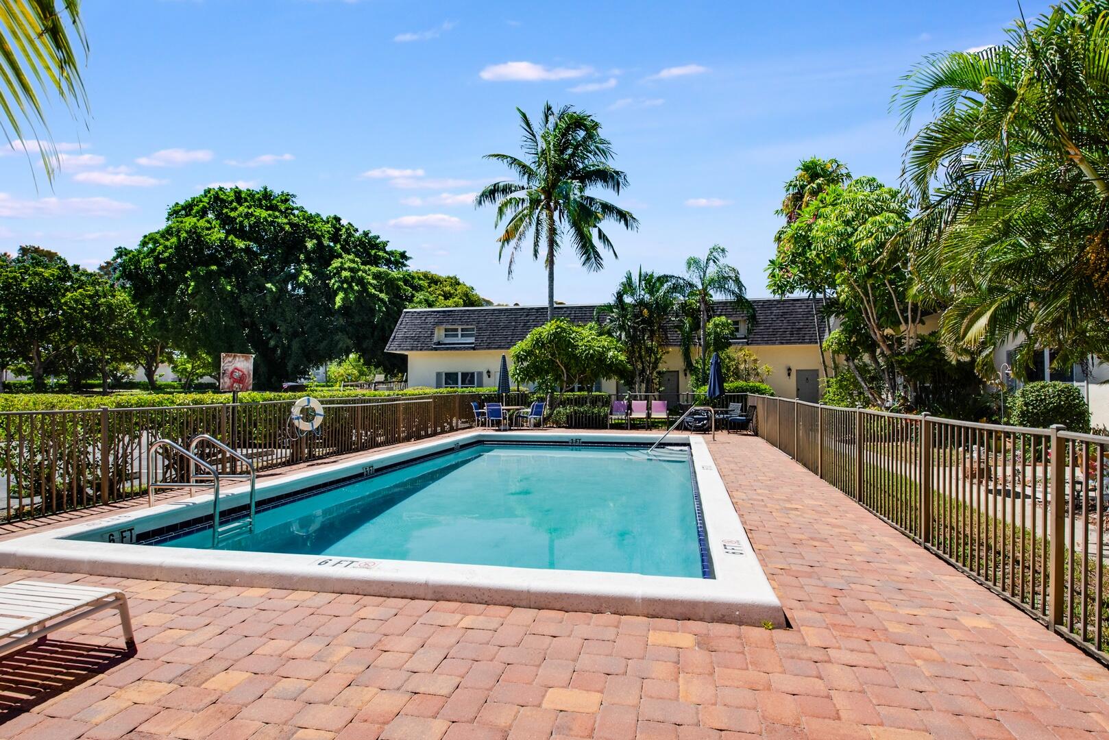 1945 Northwest 4th Avenue, Unit 30 Boca Raton, FL 33432 - Photo 30 of 30 a view of swimming pool and lounge chair