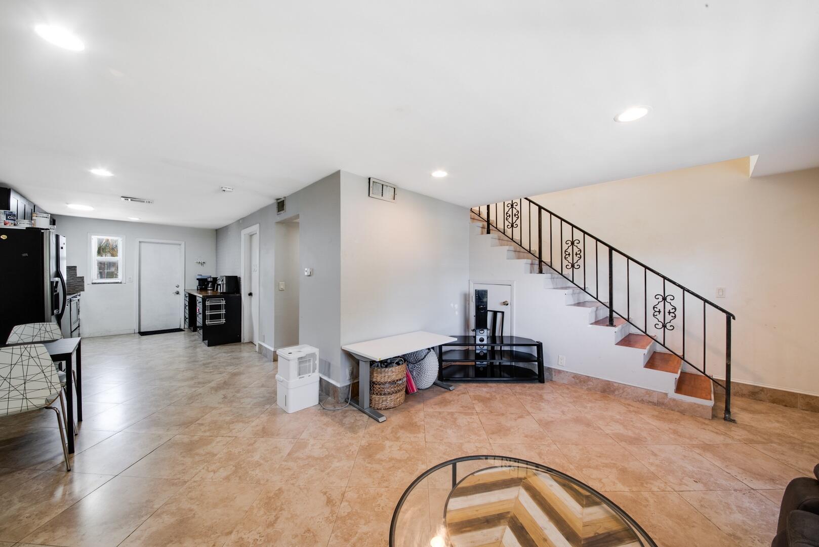 1945 Northwest 4th Avenue, Unit 30 Boca Raton, FL 33432 - Photo 10 of 30 a living room with furniture and a flat screen tv