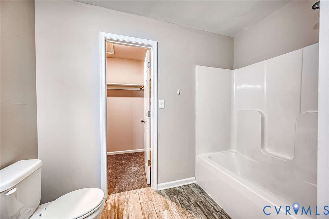 7045 Tranquility Lane Sutherland, VA 23885 - Photo 14 of 27 a bathroom with a toilet and shower