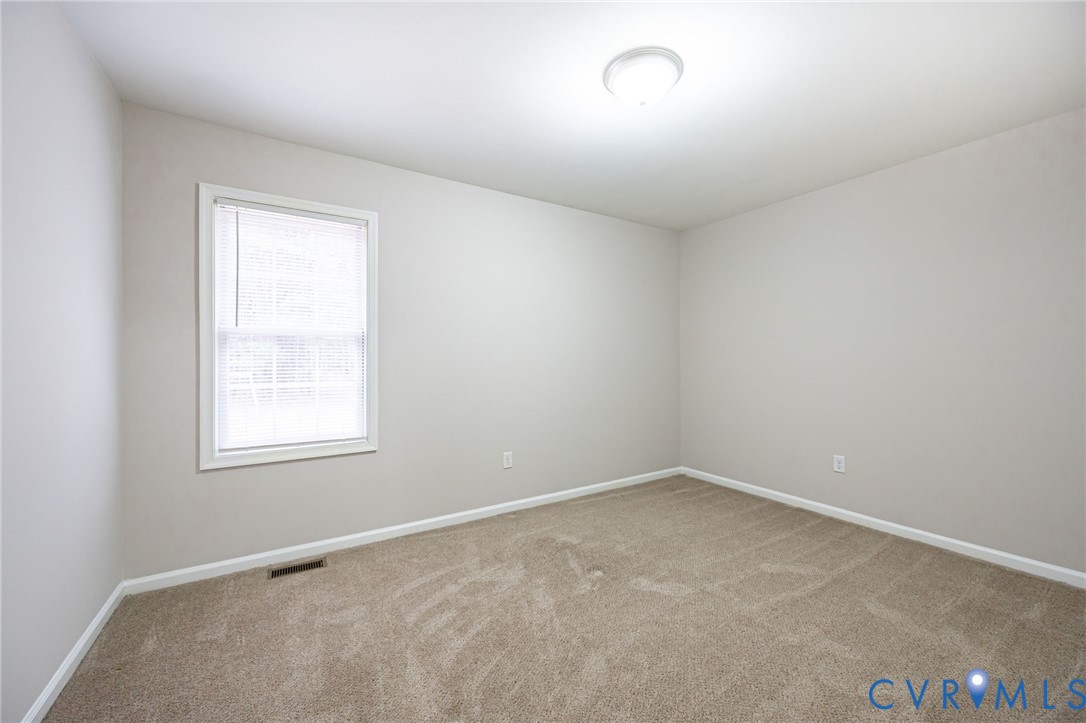 7045 Tranquility Lane Sutherland, VA 23885 - Photo 16 of 27 an empty room with a window