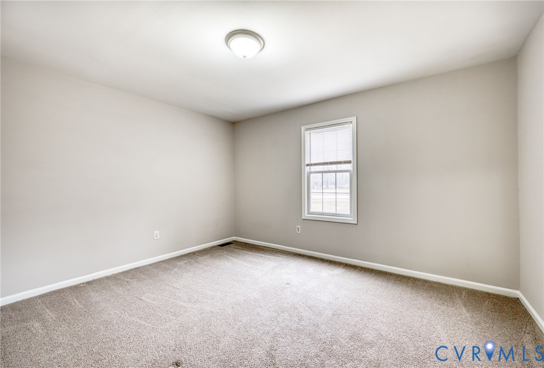 7045 Tranquility Lane Sutherland, VA 23885 - Photo 19 of 27 an empty room with a window